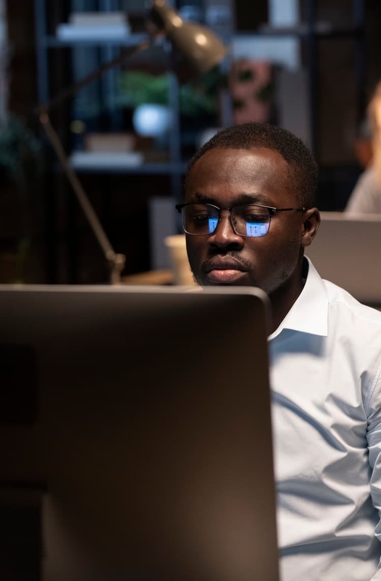 A developer working late on a laptop